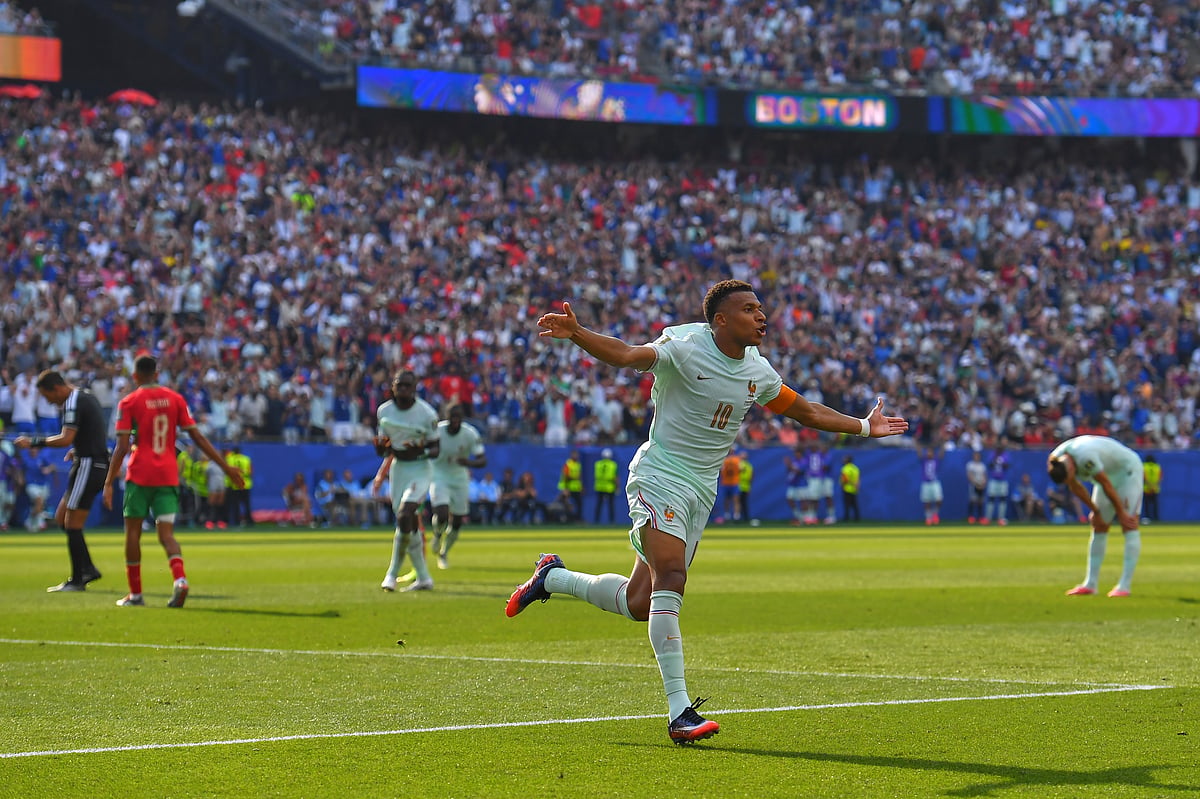 France's Kylian Mbappe celebrates scoring the opening goal during the World Cup quarterfinal soccer match - AP/Steven Senne