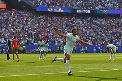 France's Kylian Mbappe celebrates scoring the opening goal during the World Cup quarterfinal soccer match - AP/Steven Senne