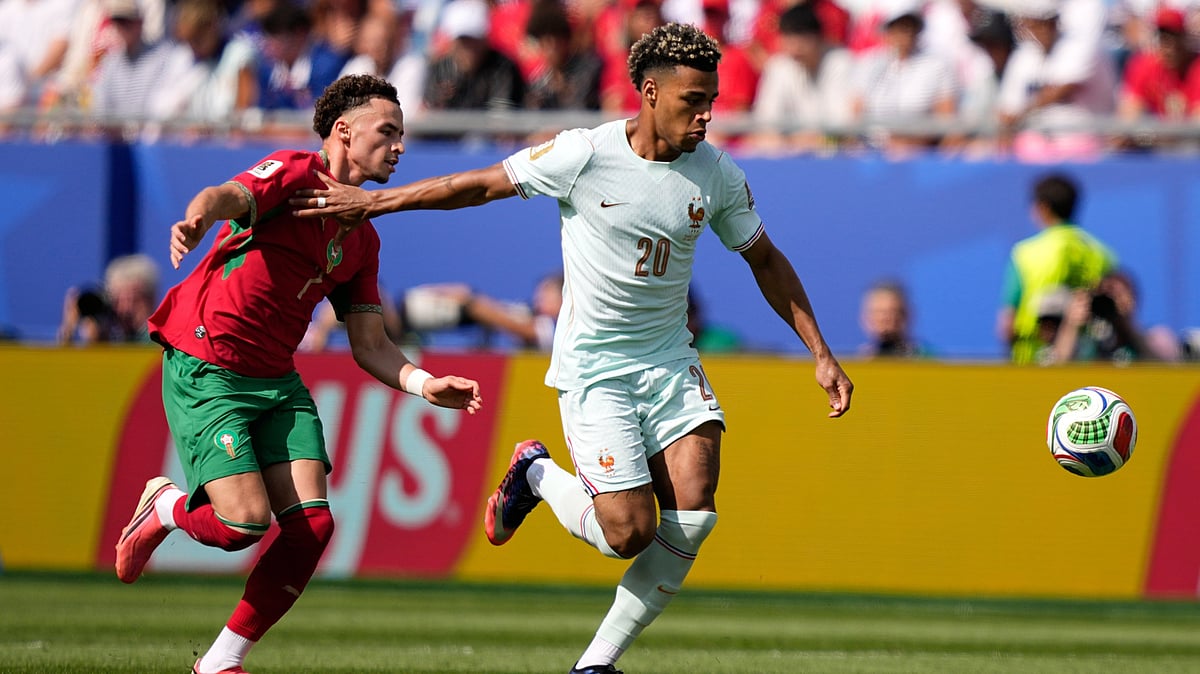 France's Desire Doue shields the ball from Morocco's Chemsdine Talbi during the World Cup quarterfinal soccer match - AP/Matt Slocum