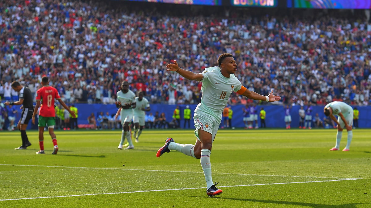 France's Kylian Mbappe (10) celebrates scoring the opening goal during the World Cup quarterfinal soccer match between France and Morocco in Foxborough. - AP/Steven Senne