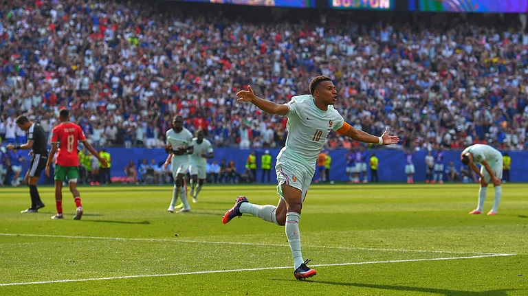 France's Kylian Mbappe (10) celebrates scoring the opening goal during the World Cup quarterfinal soccer match between France and Morocco in Foxborough. - AP/Steven Senne