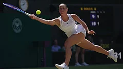 Marta Kostyuk of Ukraine returns the ball to Jasmine Paolini of Italy, in their quarter-final women's singles match at the Wimbledon Tennis Championships in London. - Photo: AP/Brian Inganga