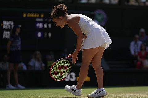 Jasmine Paolini of Italy reacts to losing a point against Marta Kostyuk of Ukraine in their quarter-final women's singles match at the Wimbledon Tennis Championships in London.