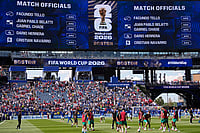 AP/Matt Slocum : The names of the match officials are displayed on the video screen while Morocco, foreground