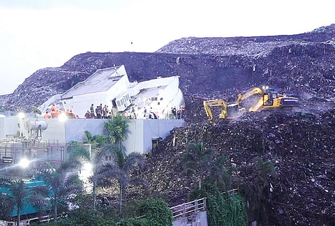 People gather after a huge mound of garbage crashed onto a three-storey building, causing it to collapse, following heavy rainfall, in Pimpri Chinchwad, Pune, Maharashtra, Wednesday, July 8, 2026. 