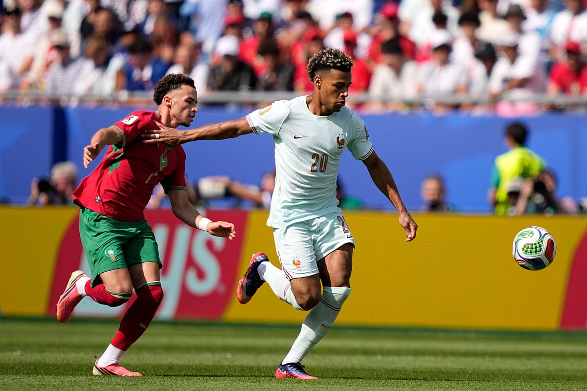France's Desire Doue shields the ball from Morocco's Chemsdine Talbi during the World Cup quarterfinal soccer match - AP/Matt Slocum