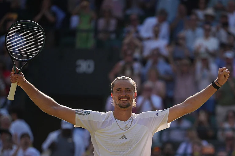 Alexander Zverev of Germany celebrates winning against Taylor Fritz of the United States in their quarter-final men's singles match at the Wimbledon Tennis Championships in London. - | Photo: AP/Kin Cheung