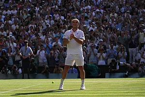 | Photo: AP/Brian Inganga : Arthur Fery of Britain reacts to winning against Flavio Cobolli of Italy in their quarter-final men's singles match at the Wimbledon Tennis Championships in London.