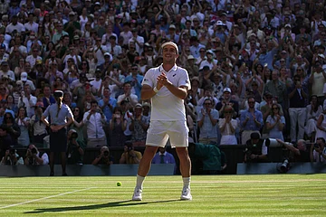 | Photo: AP/Brian Inganga : Arthur Fery of Britain reacts to winning against Flavio Cobolli of Italy in their quarter-final men's singles match at the Wimbledon Tennis Championships in London.