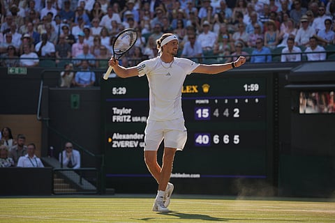 Alexander Zverev of Germany celebrates winning against Taylor Fritz of the United States in their quarter-final men's singles match at the Wimbledon Tennis Championships in London.