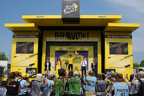 Norway's Torstein Traeen wearing the overall leader's yellow jersey celebrates on the podium after the fifth stage of the Tour de France cycling race with start in Lannemezan and finish in Pau, France.