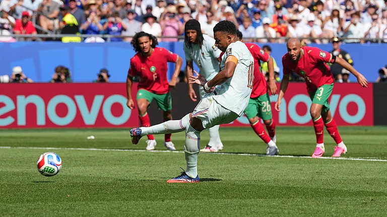 France's Kylian Mbappe (10) make a penalty kick during the World Cup quarterfinal soccer match between France and Morocco - AP/Martin Meissner