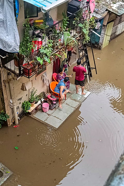 A street in a residential area remains waterlogged after authorities released water from the Khadakwasla Dam into the Mutha river following heavy rains in the catchment areas of Pune's reservoirs, Wednesday, July 8, 2026.