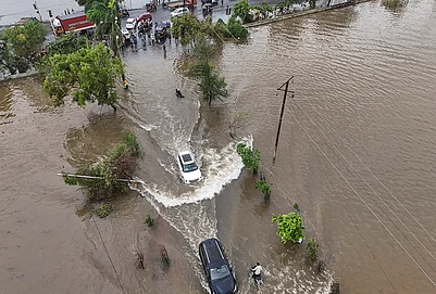 | Photo: PTI/Kunal Patil : Vehicles make their way through a waterlogged road after heavy rainfall, at Vasai-Virar in Palghar district, Maharashtra, Wednesday, July 8, 2026.
