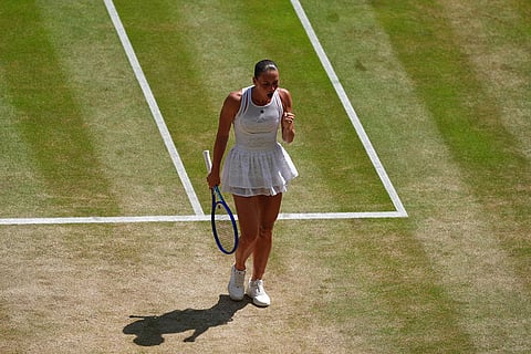 Marta Kostyuk of Ukraine reacts after winning a point against Jasmine Paolini of Italy in their quarter-final women's singles match at the Wimbledon Tennis Championships in London.
