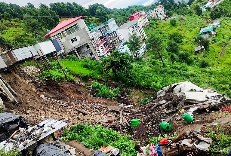 A damaged building after a landslide near Kaddukhal on National Highway 707A following heavy rainfall, in Tehri Garhwal, Uttarakhand. No casualties were reported. - | Photo: PTI