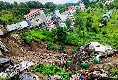 | Photo: PTI : A damaged building after a landslide near Kaddukhal on National Highway 707A following heavy rainfall, in Tehri Garhwal, Uttarakhand. No casualties were reported.