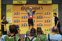 The Fastest Man in Pau: Olav Kooij Blazes To Tour De France Stage 5 Glory | Photo: AP/Thibault Camus : Netherland's Olav Kooij celebrates on the podium after winning the fifth stage of the Tour de France cycling race with start in Lannemezan and finish in Pau, France.