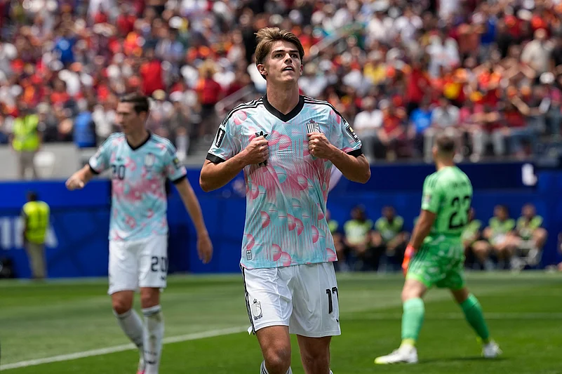 Belgiums Charles De Ketelaere (17) celebrates scoring their first goal during the World Cup quarterfinal soccer match between Spain and Belgium in Inglewood,