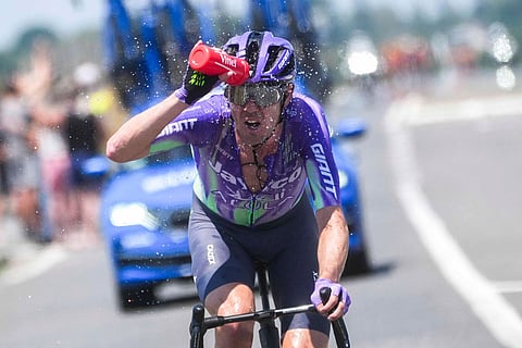 Australia's Ben O'Connor cools himself down during the sixth stage of the Tour de France cycling race over 201.5 kilometers (115.5 miles) with start in Pau and finish in Gavarnie-Gedre, France.