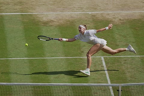 Karolina Muchova of Czech Republic hits a return to Coco Gauff of the United States during their women's singles semifinal match at the Wimbledon Tennis Championships in London.