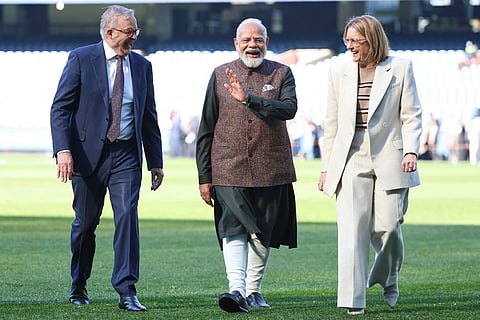 Australian Prime Minister Anthony Albanese, left, reacts as he walks with Indian Prime Minister Narendra Modi, center, and the Premier of Victoria, Jacinta Allan at the Melbourne Cricket Ground in Melbourne, Australia.
