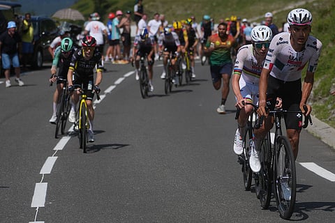 Slovenia's Tadej Pogacar, center right, and Mexico's Isaac Del Toro, right lead the race as Denmark's Jonas Vingegaard, left, looks on during the sixth stage of the Tour de France cycling race with start in Pau and finish in Gavarnie-Gedre, France.
