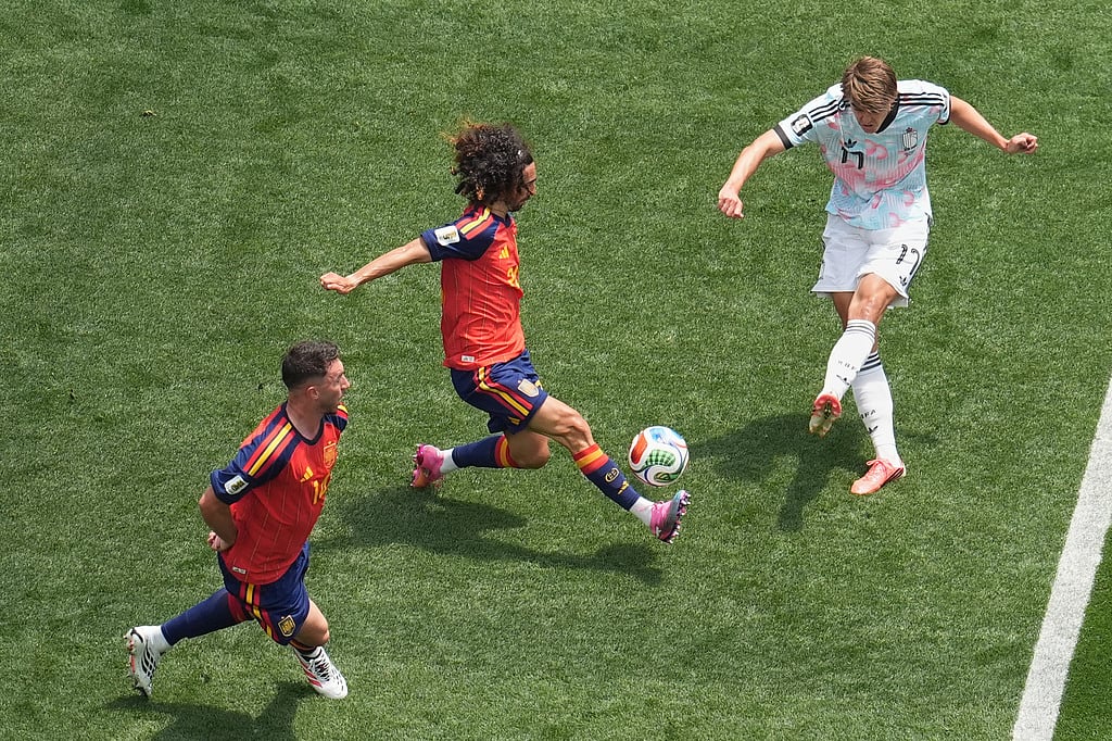 Spains Marc Cucurella (24) blocks shot by Belgiums Charles De Ketelaere (17) during the World Cup quarterfinal soccer match between Spain and Belgium in Inglewood