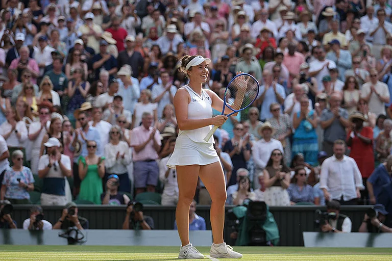 Linda Noskova of the Czech Republic celebrates winning against Marta Kostyuk of Ukraine in their semifinal women's singles match at the Wimbledon Tennis Championships in London. - | Photo: AP/Kirsty Wigglesworth