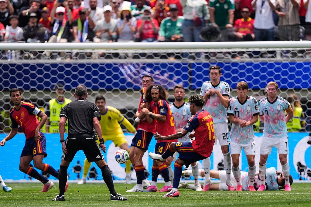 Spains Lamine Yamal (19) takes a free kick during the World Cup quarterfinal soccer match between Spain and Belgium in Inglewood