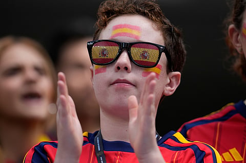 A supporter cheers before the World Cup quarterfinal soccer match between Spain and Belgium in Inglewood, Calif., near Los Angeles