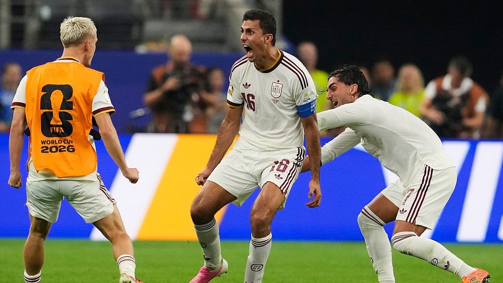 Spain's Ferran Torres (7) and Spain's Rodri (16) celebrate after Spain's Mikel Merino (6) scored their first goal during the World Cup round of 16 soccer match between Portugal and Spain. - AP Photo/Tony Gutierrez