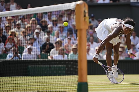 Coco Gauff of the United States returns the ball to Karolina Muchova of the Czech Republic in their semifinal women's singles match at the Wimbledon Tennis Championships in London.