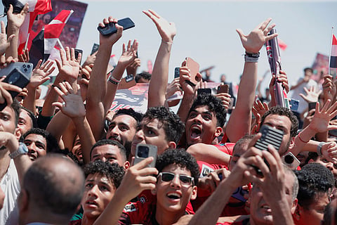 Fans crowd to greet the Egyptian national soccer team during their arrival at El-Alamein airport, 160 km (99 miles) west of Alexandria, Egypt.