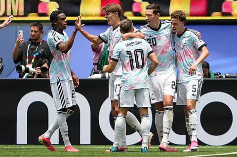 Belgium's Charles De Ketelaere (17), second left, celebrates with teammates after scoring his side's opening goal during the World Cup quarterfinal soccer match between Spain and Belgium in Inglewood