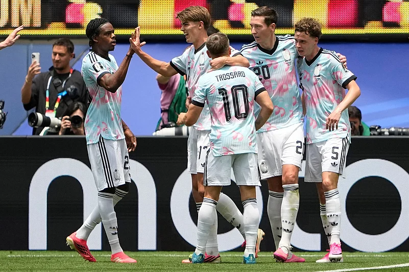 Belgiums Charles De Ketelaere (17), second left, celebrates with teammates after scoring his sides opening goal during the World Cup quarterfinal soccer match between Spain and Belgium in Inglewood