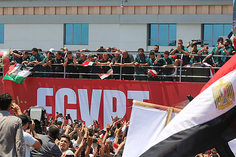 Fans crowd to greet the Egyptian national soccer team during their arrival at El-Alamein airport, 160 km (99 miles) west of Alexandria, Egypt.