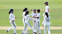  (Nigel French/PA via AP) : India's Kranti Gaud (second right) celebrates with her team mates after taking the wicket of England's Tammy Beaumont, background right, during day one of the first Women's Rothesay Test between India and England at Lord's Cricket Ground in London, Friday, July 10, 2026.