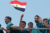 | Photo: AP : Mohamed Salah, right, smiles as he is greeted by fans upon the Egyptian national soccer team arrival at El-Alamein airport, 160 km (99 miles) west of Alexandria, Egypt.