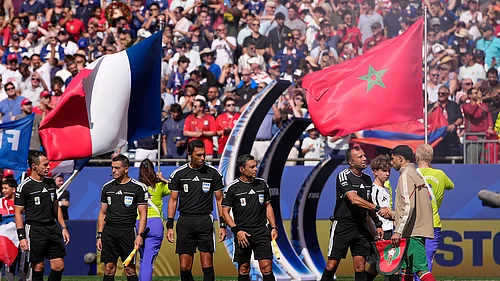 AP/Matt Slocum : Moroccos Achraf Hakimi, right greets the referee crew of referee Facundo Tello, center, assistant referees Juan Pablo Belatti and Gabriel Chade, fourth official Dario Herrera and reserve assistant referee Cristian Navarro, all five from Argentina, before the World Cup quarterfinal soccer match between France and Morocco in Foxborough