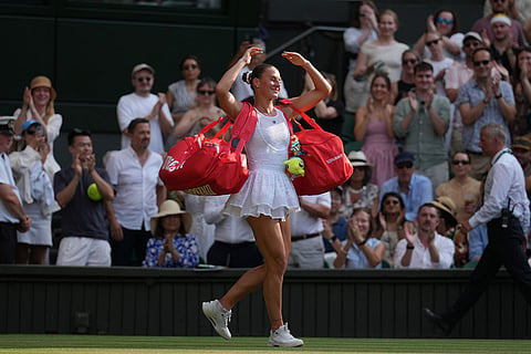 Marta Kostyuk of Ukraine dances as she leaves after losing to Linda Noskova of the Czech Republic in their semifinal women's singles match at the Wimbledon Tennis Championships in London.