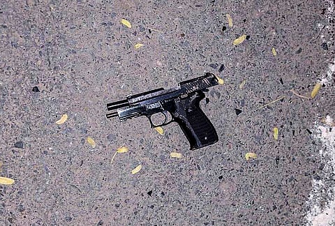 A pistol recovered from the site of an encounter between Gurugram Police Crime Branch teams and suspected criminals in the Sushant Lok Phase-2 area, in Gurugram. As per officials, four suspected criminals were killed and one was injured in the encounter, while three police personnel also sustained gunshot injuries. 