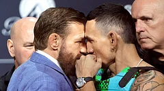 UFC welterweight fighters Conor McGregor, left, and Max Holloway face off during a news conference for the UFC 329 mixed martial arts event, Thursday, July 9, 2026, in Las Vegas - (Steve Marcus/Las Vegas Sun via AP)