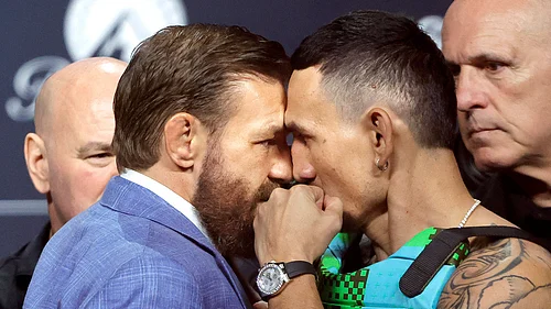 (Steve Marcus/Las Vegas Sun via AP) : UFC welterweight fighters Conor McGregor, left, and Max Holloway face off during a news conference for the UFC 329 mixed martial arts event, Thursday, July 9, 2026, in Las Vegas