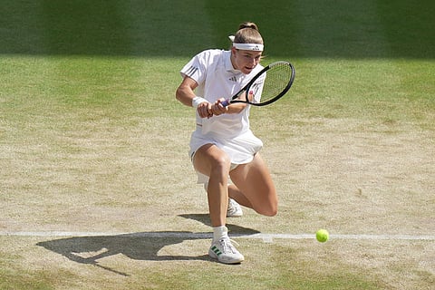 Karolina Muchova of Czech Republic hits a return to Coco Gauff of the United States during their women's singles semifinal match at the Wimbledon Tennis Championships in London.