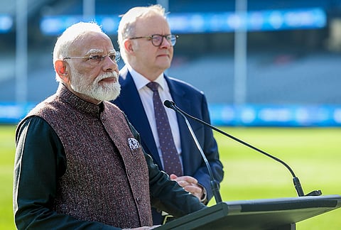 Prime Minister Narendra Modi, left, and Australian Prime Minister Anthony Albanese hold a press conference on the field at the Melbourne Cricket Ground, in Melbourne, Australia. 