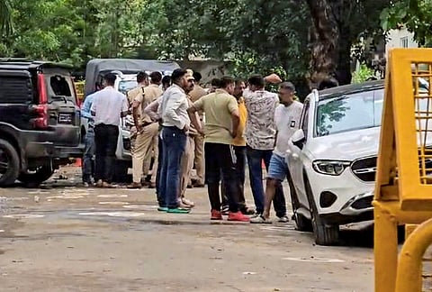 Police personnel at the site following an encounter between Gurugram Police Crime Branch teams and suspected criminals in the Sushant Lok Phase-2 area, in Gurugram. As per officials, four suspected criminals were killed and one was injured in the encounter, while three police personnel also sustained gunshot injuries. 