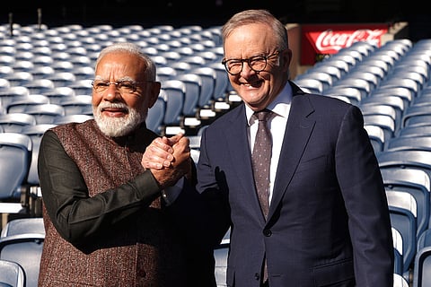Indian Prime Minister Narendra Modi, left, and Australian Prime Minister Anthony Albanese, right, pose for a photo at the Melbourne Cricket Ground in Melbourne, Australia.