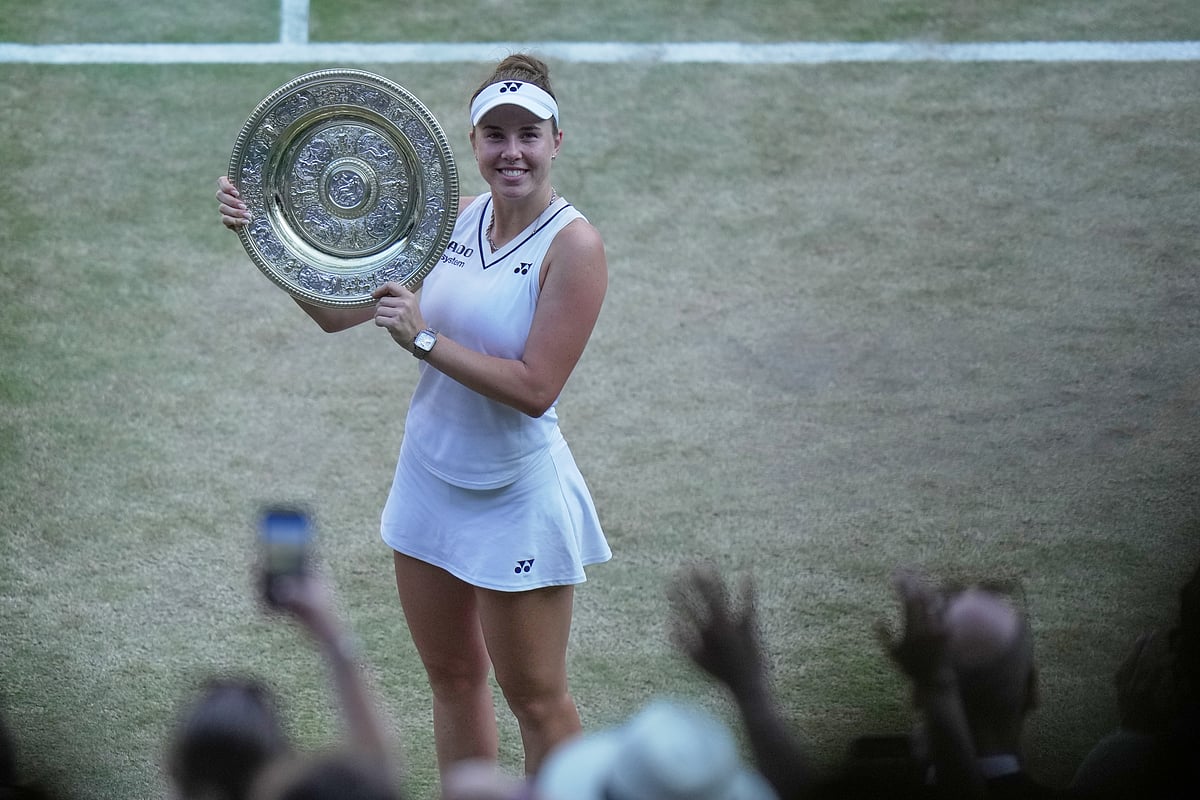 Linda Noskova of Czech Republic reacts as she holds the trophy after winning against Karolina Muchova of Czech Republic in the women's singles final at Wimbledon Tennis Championships in London - AP/Brian Inganga