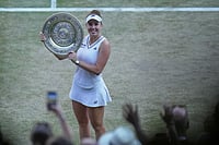 A Star Is Born! Linda Noskova Outlasts Fellow Czech To Script Wimbledon Fairytale AP/Brian Inganga : Linda Noskova of Czech Republic reacts as she holds the trophy after winning against Karolina Muchova of Czech Republic in the women's singles final at Wimbledon Tennis Championships in London